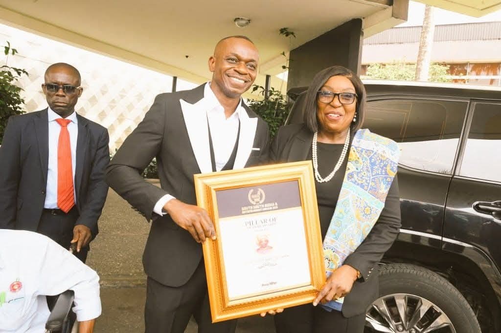 SSMEA President Sammy Wejinya presents an award to Rivers State Deputy Governor, Professor Ngozi Nma Odu